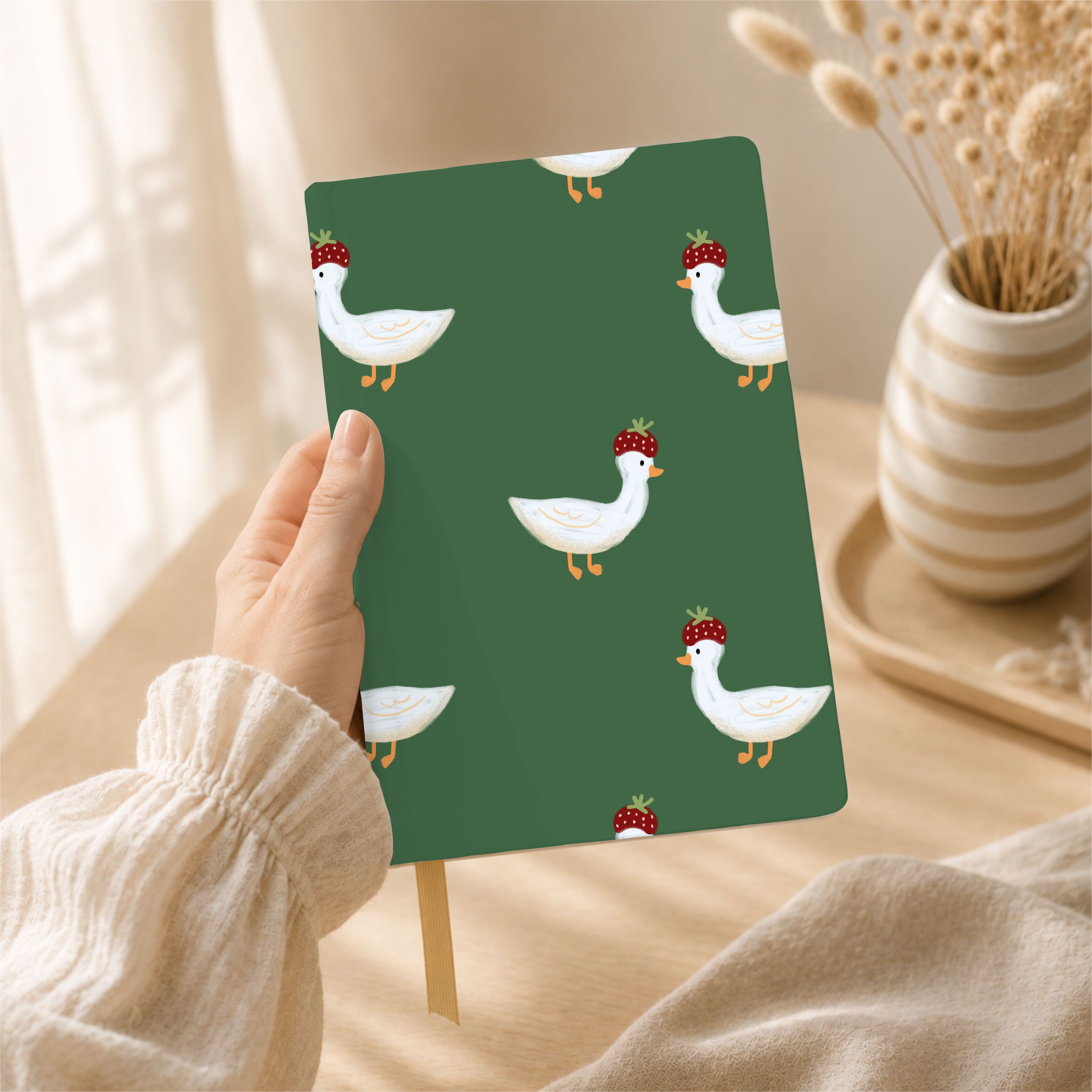 Strawberry.hat.goose 0 pattern shown on a notebook mockup